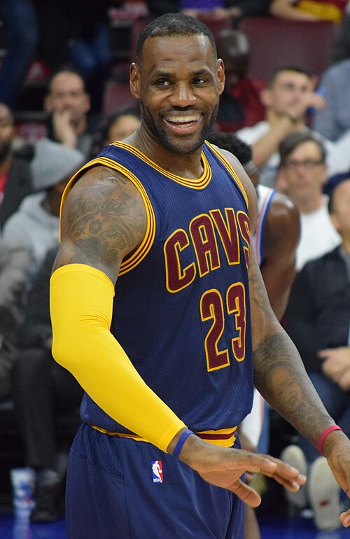 LeBron James smiling in a Cleveland Cavaliers uniform in 2016. Player photograph, not card artwork.